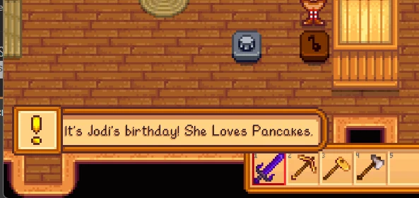 In-game notification reading "It's Jodi's birthday! She Loves Pancakes."